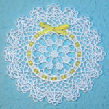 small lace doily with ribbon